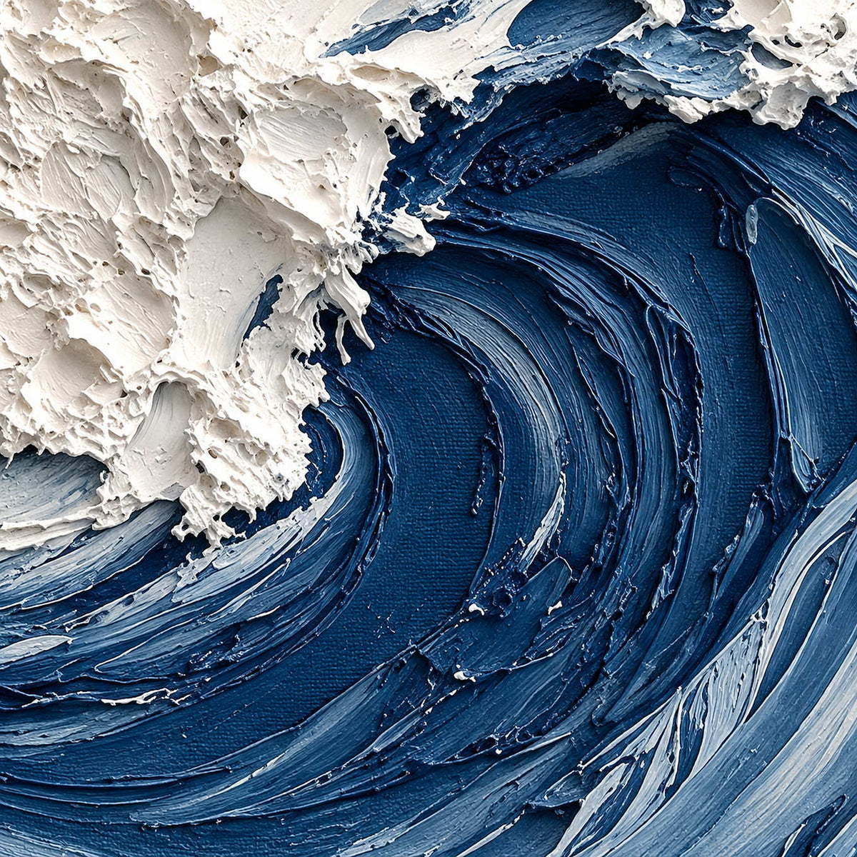 Close-up of deep blue curved wave ridges beneath rough, raised white foam.