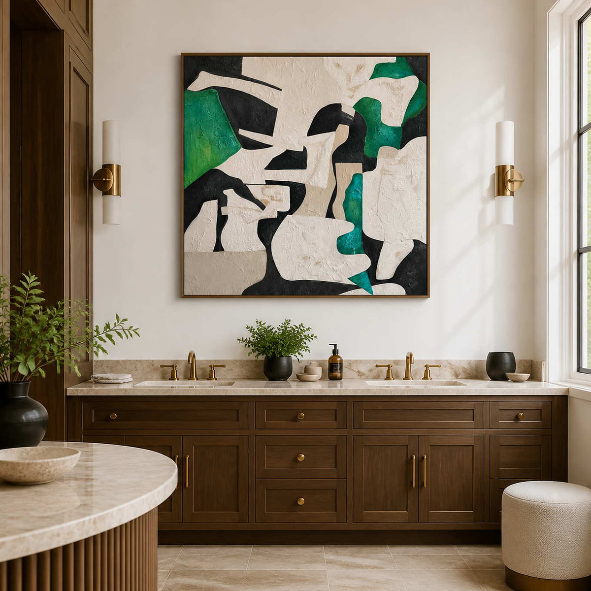 Wood framed green and cream artwork above a double vanity with brass faucets.