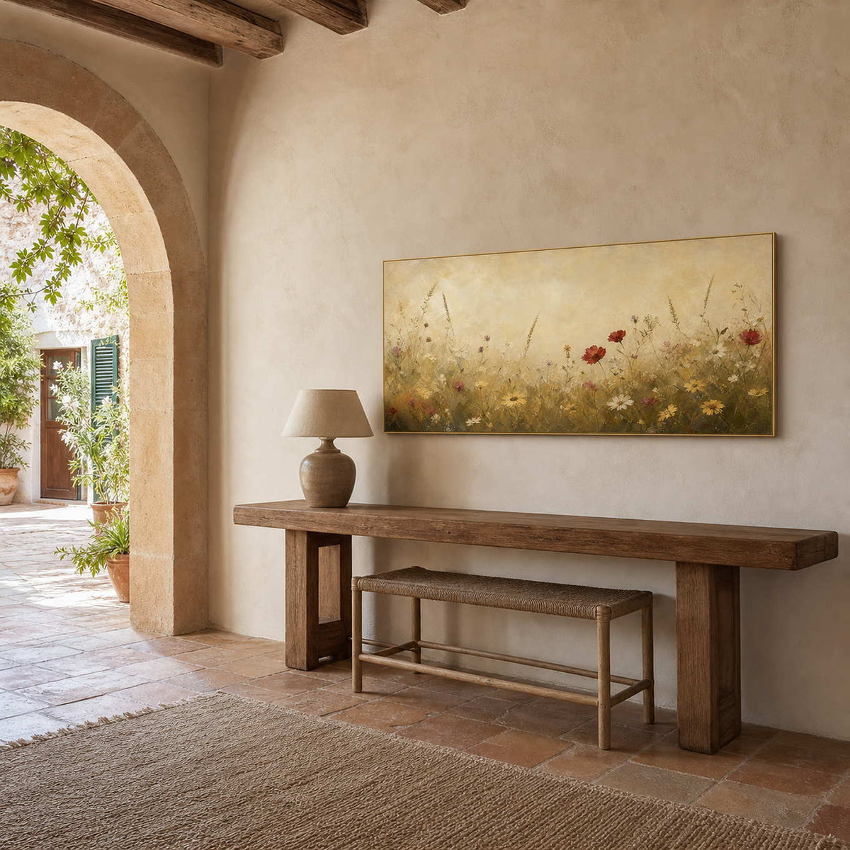 Warm floral wall art above a rustic Mediterranean entryway console.