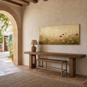 Warm floral wall art above a rustic Mediterranean entryway console.
