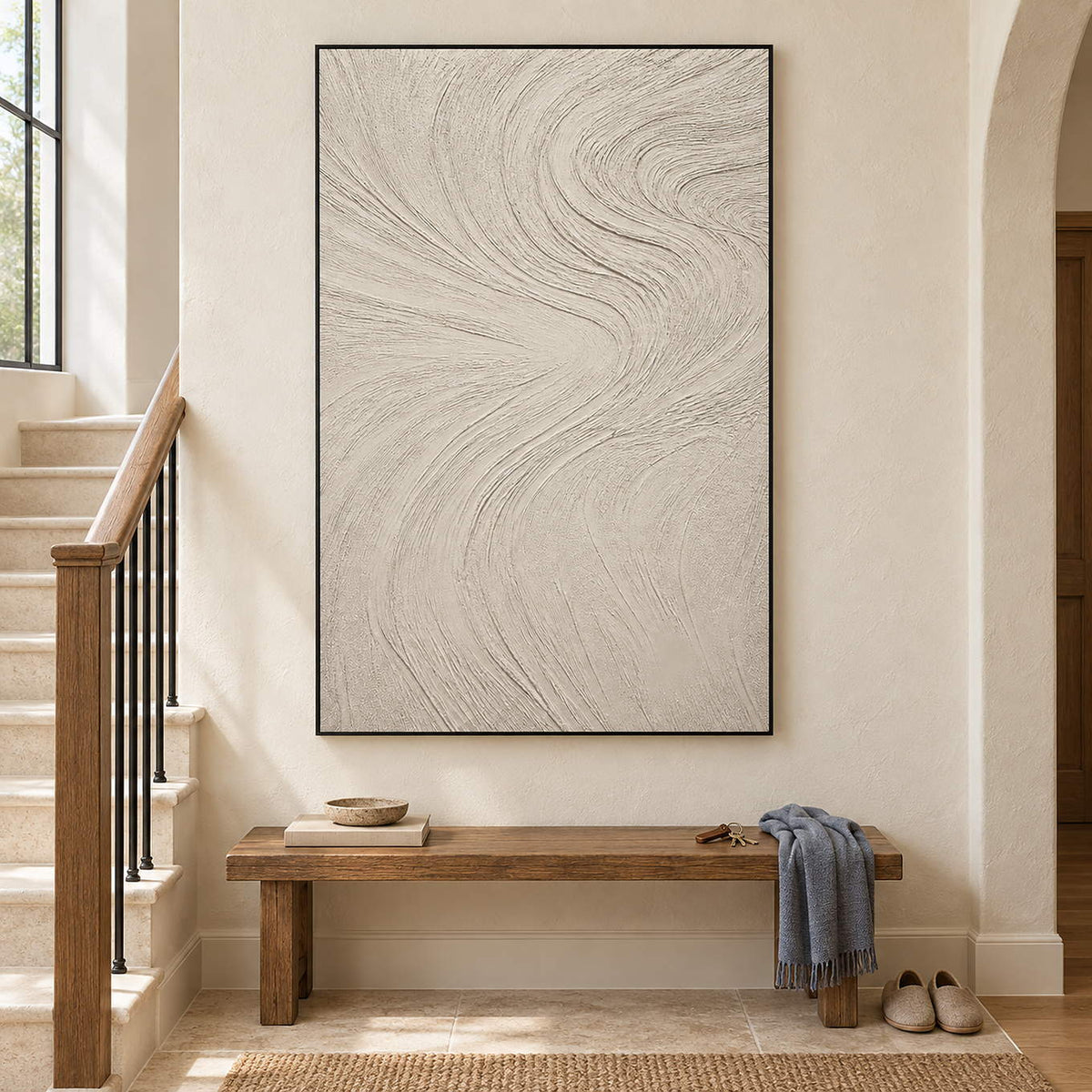 Ivory relief painting with fine flowing wave-like ridges in a black frame on a stair landing.