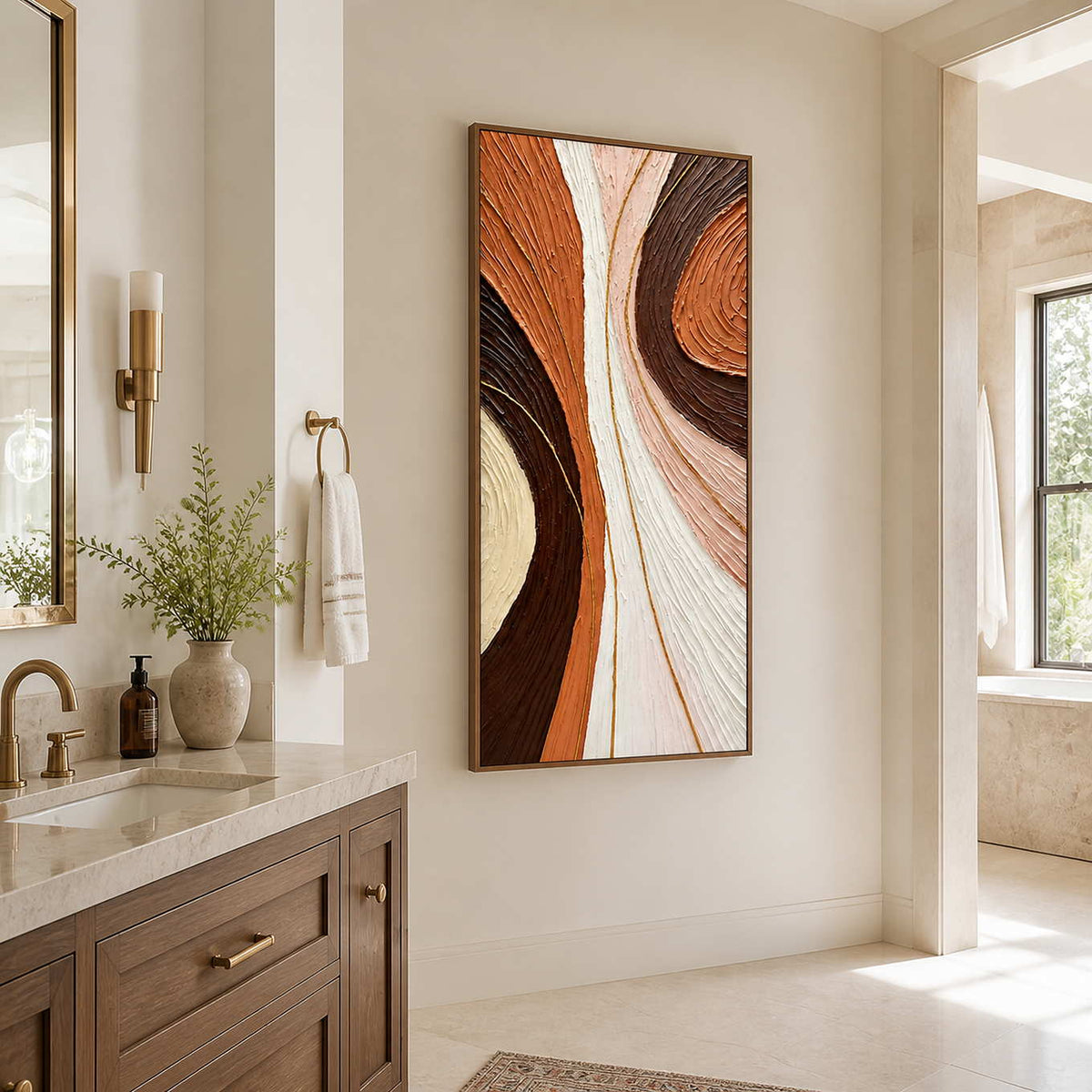 Wood-framed textured abstract wall art beside a bathroom vanity near a bright window.
