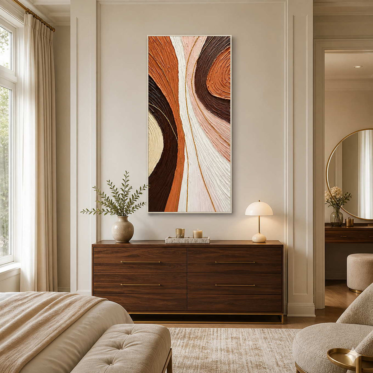 White-framed warm abstract wall art above a wooden dresser in a neutral bedroom.