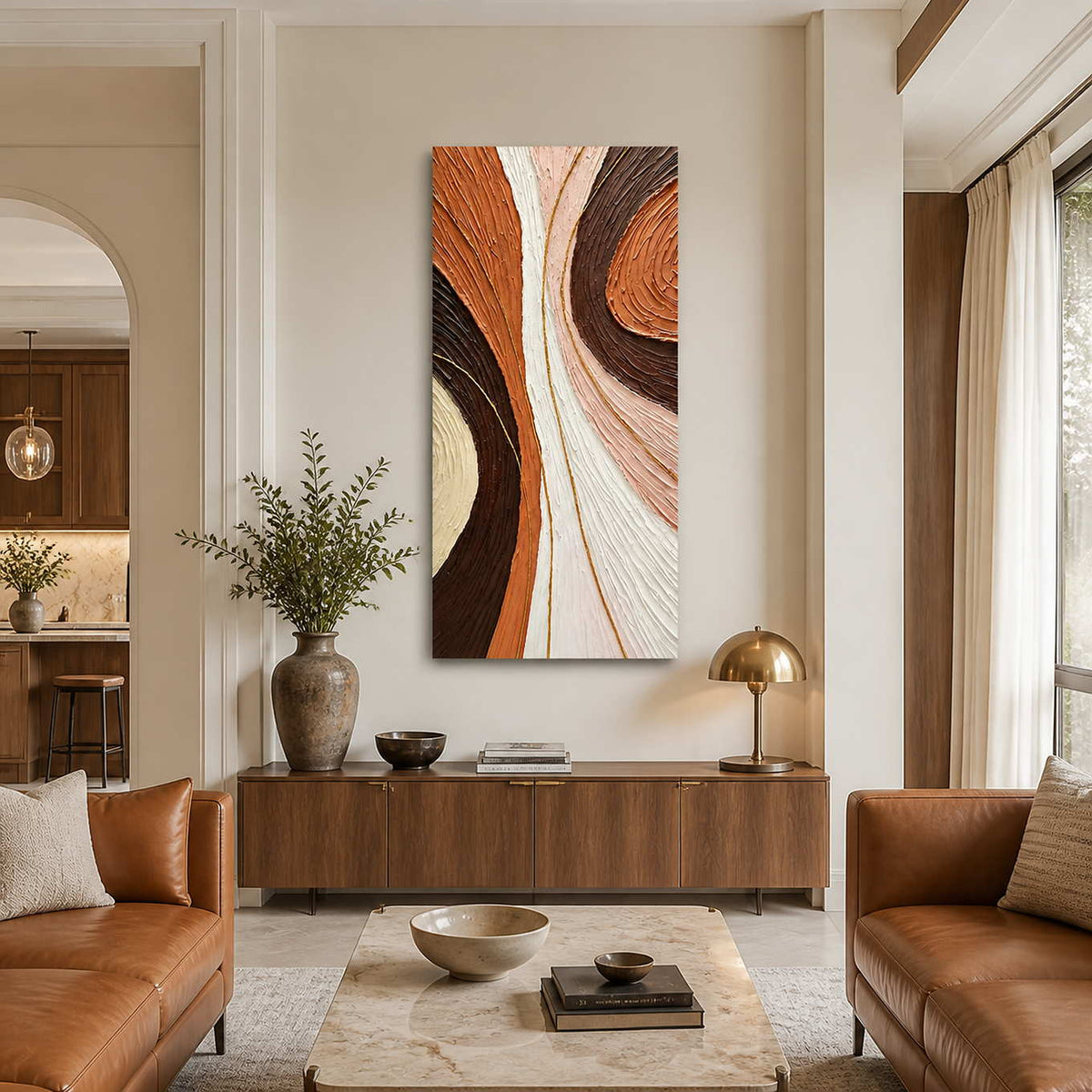 Tall textured abstract wall art above a wooden sideboard between caramel leather sofas.