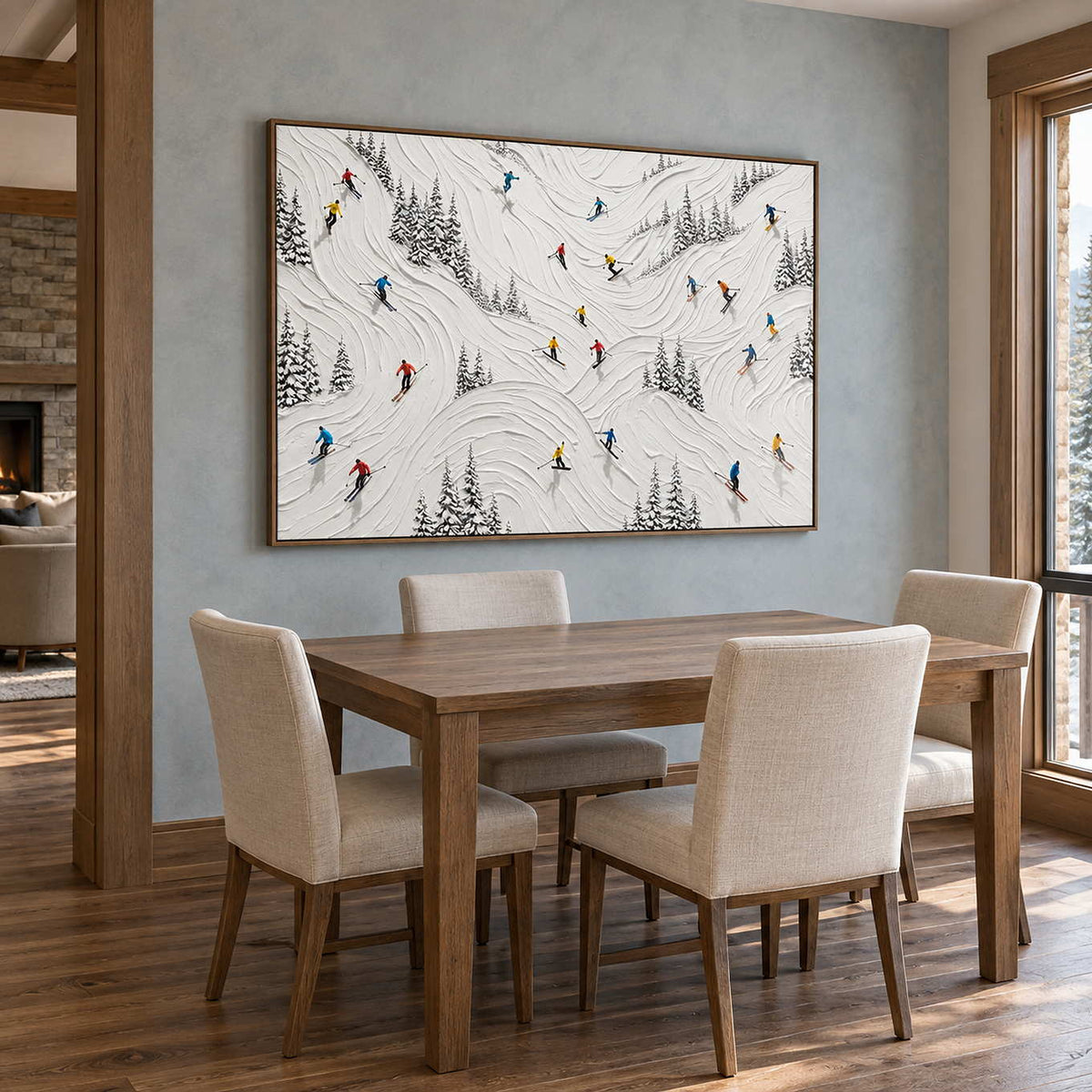 Winter at Play in a brown wood frame above a wood dining table beside a mountain-facing window.