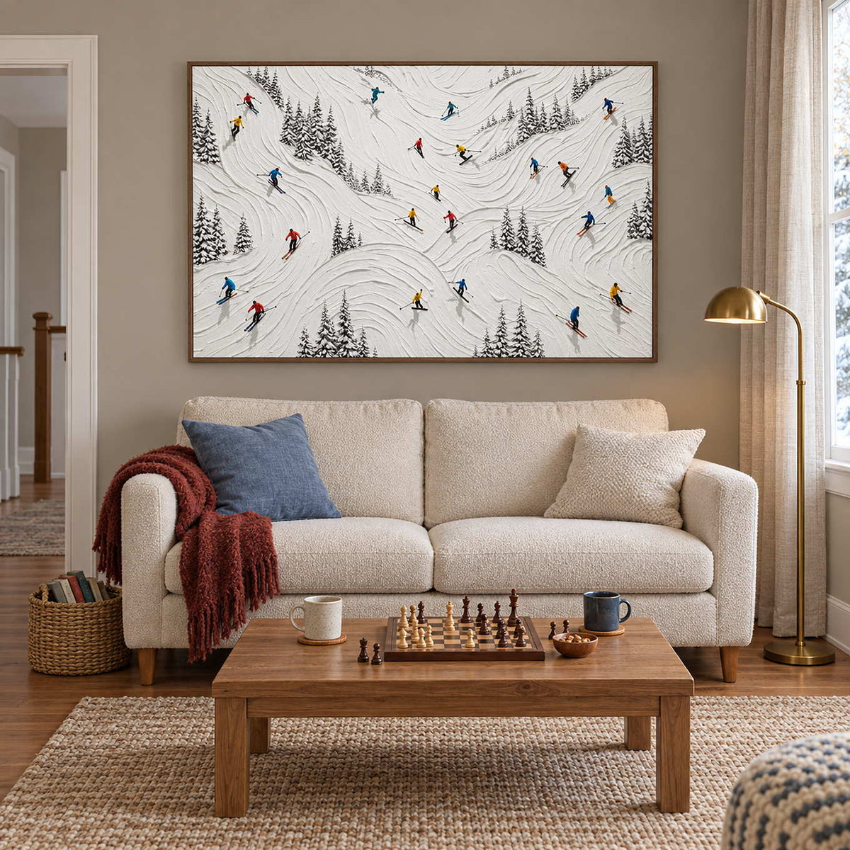 Winter at Play in a brown wood frame above a cream sofa and a coffee table set with a chessboard.