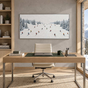 Winter Joy in a silver frame above a light wood desk and cream office chair between shelves and a tall window.