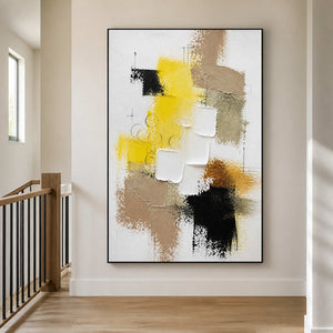 Vertical textured wall art creating a bright focal point in a stair hall.