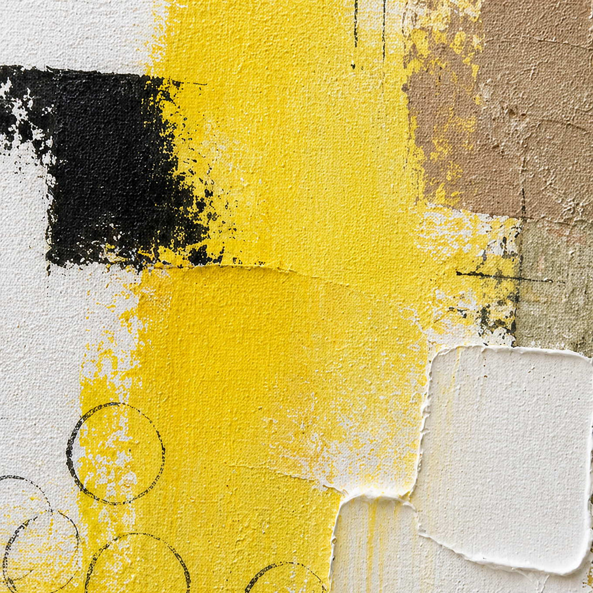 Close-up of layered yellow, black, taupe, and white hand-painted texture.